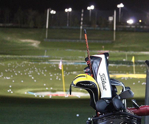Night scene with lit golf driving stations Night scene with lit golf driving stations